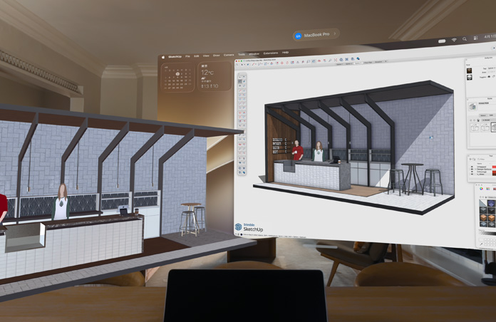 Apple Vision Proのビュー。台の上にMacBook Proが置かれ、その背後に3Dモデルが映し出されている。モデルには、カフェのサービスカウンターとその奥側に立つ2人の人物が表示されている