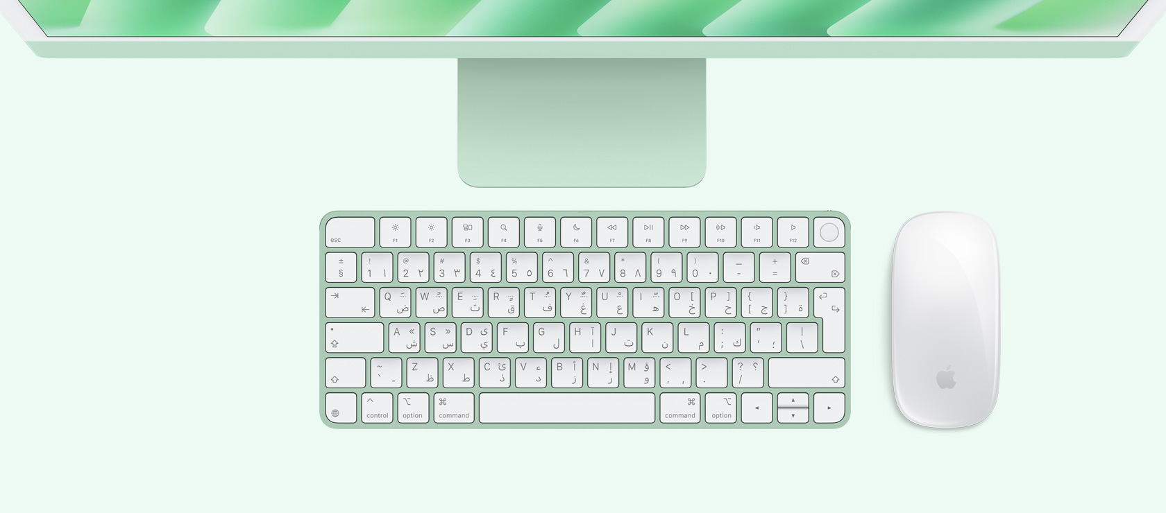 لقطة علوية لجهاز iMac باللون الأخضر مع ماوس ولوحة مفاتيح بلون يطابق لون الجهاز