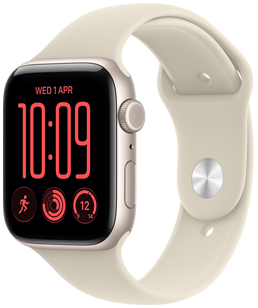 Apple Watch SE 3 z aluminiową kopertą w kolorze księżycowej poświaty i paskiem sportowym w kolorze piasku. Na tarczy Moduły widać komplikacje: dzień i datę, treningi, pierścienie aktywności oraz temperaturę. Na prawym boku urządzenia pokrętło Digital Crown i przycisk boczny