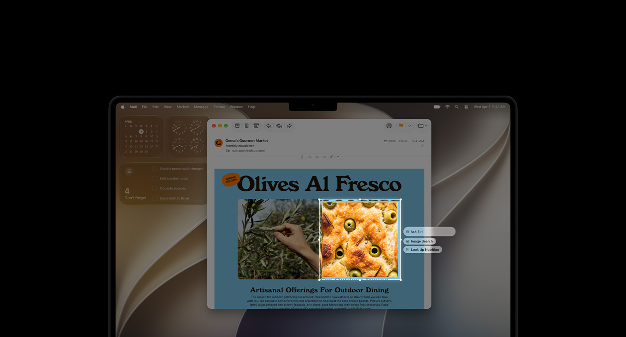 MacBook Pro 14 cali w kolorze gwiezdnej czerni. Na ekranie demo funkcji Inteligencja wizualna: mail ze zdjęciami jedzenia i ziół. Zdjęcie ciasta z oliwkami jest wzięte w ramkę, widzimy trzy sugestie do wybranego obrazu: Ask Siri, Image Search, Look Up Nutrition
