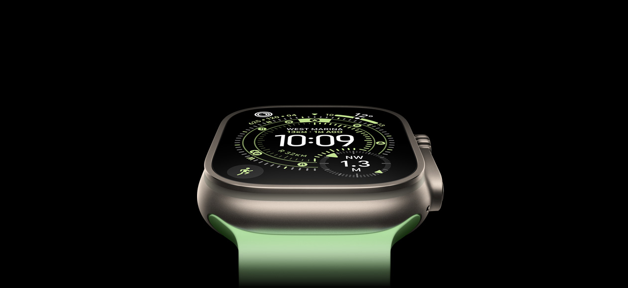 Apple Watch Ultra 3, natural titanium case, compass on Orienteering watch face, neon green Ocean Band