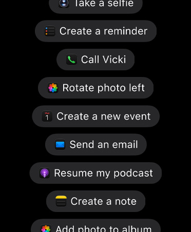 Screen with requests for Siri AI including, Take a selfie, Create a reminder, Call Vicki, Rotate photo left, Create a new event, Send an email, Resume my podcast, Create a note, Add photo to album