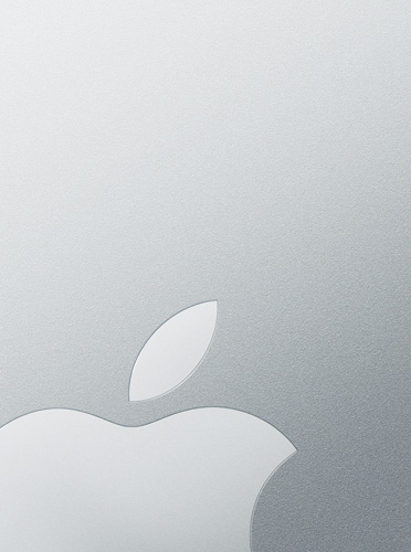 White Apple logo overlaid on a silver background, nodding to a MacBook Air lid