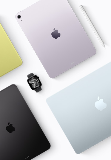 Näkymä ylhäältä alaspäin eri värisistä Mac- ja iPad-laitteista, keskellä musta Apple Watch.
