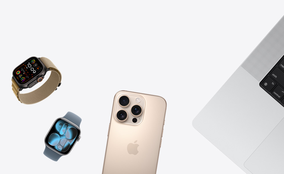 Various products in a scattered array, including Apple Watch in Natural with Tan Alpine Loop Band, Apple Watch in Silver with Periwinkle Sport Loop Band, iPhone in Desert Titanium, and MacBook in Silver