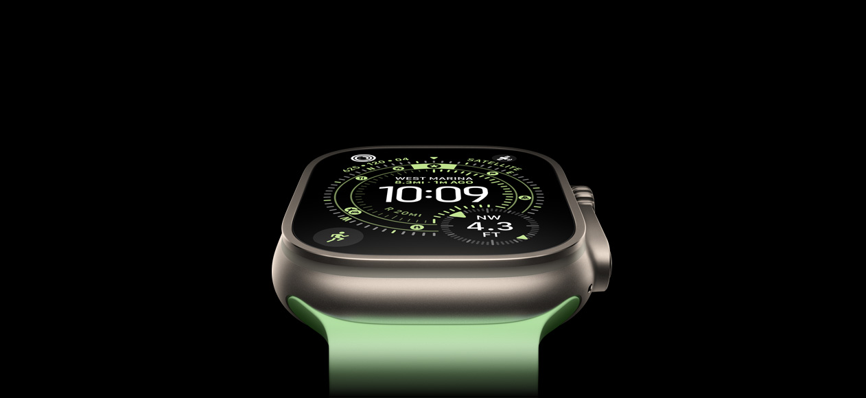 Apple Watch Ultra 3, natural titanium case, compass on Orienteering watch face, neon green Ocean Band