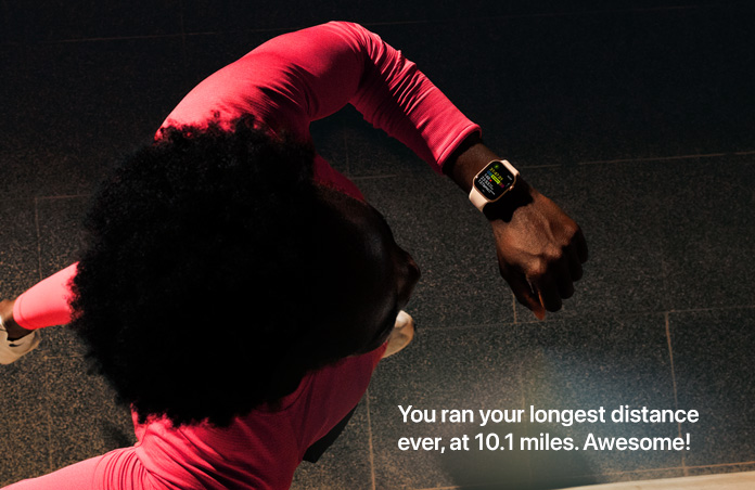 Photo of a man using his Apple Watch to track his run
